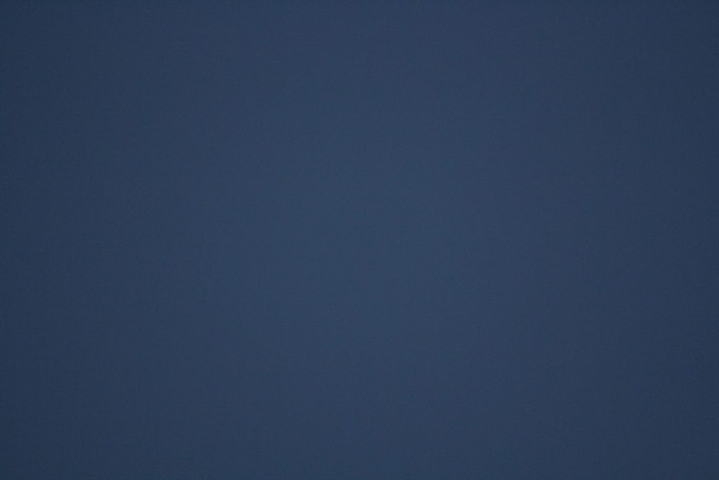 A dark blue gradient background